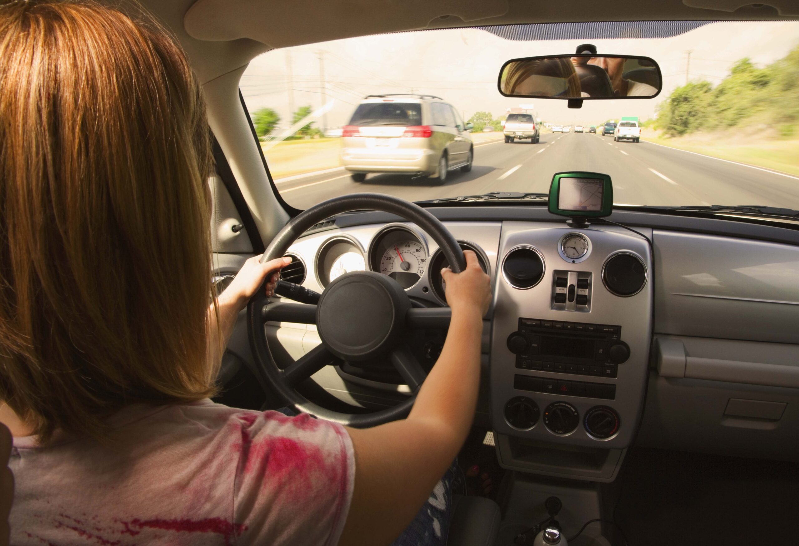 Woman driving in heavy traffic